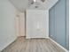 Spacious bedroom boasts wood-look floors, a paneled accent wall, and ample closet space at 729 Winterside Dr, Apollo Beach, FL 33572