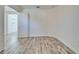 Bedroom featuring wood-look tile floors, neutral paint, and an open door to another room at 729 Winterside Dr, Apollo Beach, FL 33572