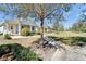 Landscaped front yard with mature trees and sidewalks enhance this home's curb appeal at 729 Winterside Dr, Apollo Beach, FL 33572