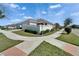 Street view showcasing the home's exterior, landscaping, and well-maintained yard with sidewalks at 729 Winterside Dr, Apollo Beach, FL 33572