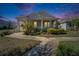 Charming single-story home with a welcoming front porch, lush landscaping, and a well-manicured lawn at 729 Winterside Dr, Apollo Beach, FL 33572