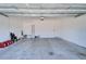 Spacious two car garage offering ample room for parking and storage, with visible ceiling supports at 729 Winterside Dr, Apollo Beach, FL 33572