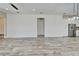 Spacious open living area with tile floors, neutral paint, and a view into the modern kitchen at 729 Winterside Dr, Apollo Beach, FL 33572