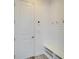 Mud room featuring coat hooks, a bench, and shoe storage by the door at 729 Winterside Dr, Apollo Beach, FL 33572