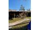 Wide backyard shot of covered deck and view of the backyard at 7413 Sherren Dr, Tampa, FL 33619