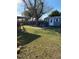 Large backyard featuring grass, a shed, and plenty of room to play at 7413 Sherren Dr, Tampa, FL 33619