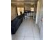 Open concept living room leading to kitchen with lots of space and exterior access at 7413 Sherren Dr, Tampa, FL 33619