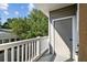 Relaxing balcony with white railing and lovely neighborhood view, perfect for enjoying a morning coffee at 800 S Dakota Ave # 217, Tampa, FL 33606