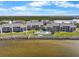 Waterfront condos with a pool, landscaping, and beautiful view of the bay at 808 Bahia Del Sol Dr # 14, Ruskin, FL 33570