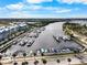 An aerial view of a waterfront condo complex showcasing a marina filled with boats at 808 Bahia Del Sol Dr # 14, Ruskin, FL 33570