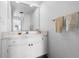 Clean bathroom featuring a vanity with ample storage space and a large mirror at 808 Bahia Del Sol Dr # 14, Ruskin, FL 33570
