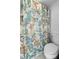 Well-maintained bathroom featuring a toilet and a shower with stylish, coastal-themed curtain at 808 Bahia Del Sol Dr # 14, Ruskin, FL 33570