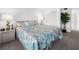 Serene bedroom featuring a comfortable bed with coastal-themed bedding and a large closet at 808 Bahia Del Sol Dr # 14, Ruskin, FL 33570