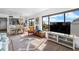 Bright living room featuring a decorative rug, neutral walls, and large windows offering scenic views at 808 Bahia Del Sol Dr # 14, Ruskin, FL 33570