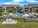 Beautiful view of community pool and lounge chairs at 808 Bahia Del Sol Dr # 14, Ruskin, FL 33570
