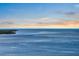 Beautiful water view with a bridge spanning the horizon at sunset at 808 Bahia Del Sol Dr # 14, Ruskin, FL 33570