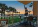 Enjoy beach views from this condo balcony, complete with seating and an umbrella at 880 Mandalay Ave # N105, Clearwater Beach, FL 33767