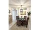 Inviting dining area featuring wicker chairs, a glass table, and coastal decor at 8901 Blind Pass Rd # 224, St Pete Beach, FL 33706