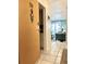 Condo entryway leading to a living room with tiled floors and beachy decor at 8901 Blind Pass Rd # 224, St Pete Beach, FL 33706