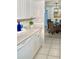 Bright kitchen with white cabinets and stainless steel hardware at 8901 Blind Pass Rd # 224, St Pete Beach, FL 33706