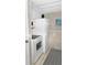 Efficient kitchen with white appliances, tiled backsplash, and ample storage at 8901 Blind Pass Rd # 224, St Pete Beach, FL 33706