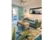 Stylish living room with a plush sofa, decorative mirror, and open access to balcony at 8901 Blind Pass Rd # 224, St Pete Beach, FL 33706