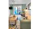 Living room featuring stylish furniture, bright natural light, and a view of the outdoor balcony at 8901 Blind Pass Rd # 224, St Pete Beach, FL 33706