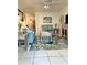 Relaxing living room with a comfortable sofa, decorative art, and wicker seating at 8901 Blind Pass Rd # 224, St Pete Beach, FL 33706
