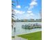 Water view of boats docked on a clear, sunny day with a view of the community across the water at 8901 Blind Pass Rd # 224, St Pete Beach, FL 33706