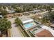 Aerial shot of a backyard pool area with a privacy fence, ideal for relaxing and entertaining guests at 9321 Gray Fox Ln, Port Richey, FL 34668