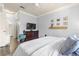 Spacious bedroom featuring wood-look floors, a ceiling fan, and a coordinating dresser for storage at 10405 Villa View Cir # 10405, Tampa, FL 33647