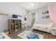 Bright bedroom featuring wood-look floors, a ceiling fan, and playful decor at 10405 Villa View Cir # 10405, Tampa, FL 33647