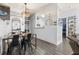 Dining area with modern industrial table, black chairs, and contemporary lighting fixture at 10405 Villa View Cir # 10405, Tampa, FL 33647