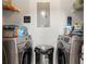 Laundry room with a new front-load washer and dryer set, along with storage shelves at 10405 Villa View Cir # 10405, Tampa, FL 33647