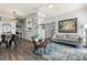 Bright living room featuring wood floors, modern furniture, and an open layout at 10405 Villa View Cir # 10405, Tampa, FL 33647