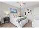 Serene main bedroom with a ceiling fan, soft lighting, and minimalist decor at 1155 27Th S Ave, St Petersburg, FL 33705