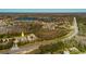 Aerial view of a residential area featuring well-maintained townhomes near a highway at 11903 Castine St, New Port Richey, FL 34654