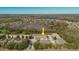 Aerial view of a community showcasing well-maintained townhomes and the surrounding natural beauty at 11903 Castine St, New Port Richey, FL 34654
