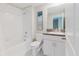 Bright bathroom featuring a tub/shower combination and granite countertop vanity at 11903 Castine St, New Port Richey, FL 34654