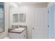 Bathroom featuring granite countertop and a large mirror at 11903 Castine St, New Port Richey, FL 34654