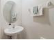 Bathroom features modern sink, mirror and towel rack at 11903 Castine St, New Port Richey, FL 34654