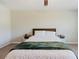 Cozy bedroom featuring a comfortable bed with stylish bedding and two bedside tables at 11903 Castine St, New Port Richey, FL 34654