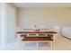 Dining room features a table with chairs and a bench with a decorative centerpiece at 11903 Castine St, New Port Richey, FL 34654