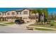 Beautifully designed townhome exterior with a garage, manicured lawn, and modern architectural details at 11903 Castine St, New Port Richey, FL 34654