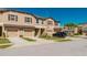 Stylish townhome exterior featuring a two-car garage, well-manicured landscaping, and inviting curb appeal at 11903 Castine St, New Port Richey, FL 34654