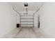 Clean garage with a garage door and plenty of space for storage at 11903 Castine St, New Port Richey, FL 34654