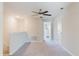 Open hallway featuring neutral walls, carpet flooring and ceiling fan, a comfortable living space at 11903 Castine St, New Port Richey, FL 34654