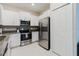 Modern kitchen featuring stainless steel appliances and ample storage at 11903 Castine St, New Port Richey, FL 34654
