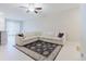 Living room showcasing a large sectional couch and a decorative rug at 11903 Castine St, New Port Richey, FL 34654