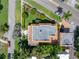 An aerial view of the home showcasing its landscaped yard, brick driveway, and distinctive architecture at 1311 Beach Ne Dr, St Petersburg, FL 33701